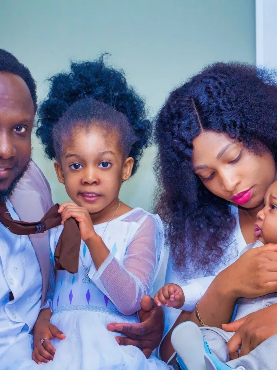 Black parents with their children in a family portrait