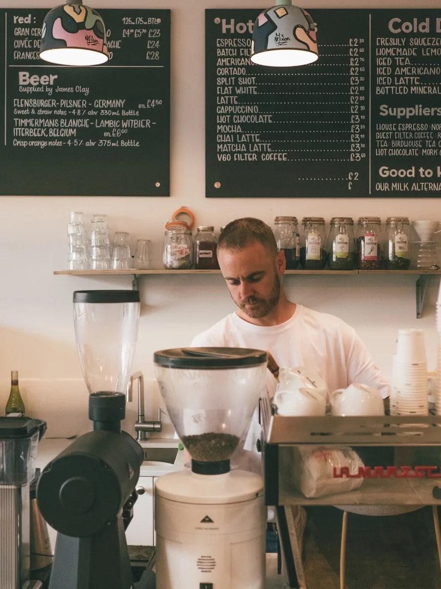 Small business owner helping a customer at the front counter